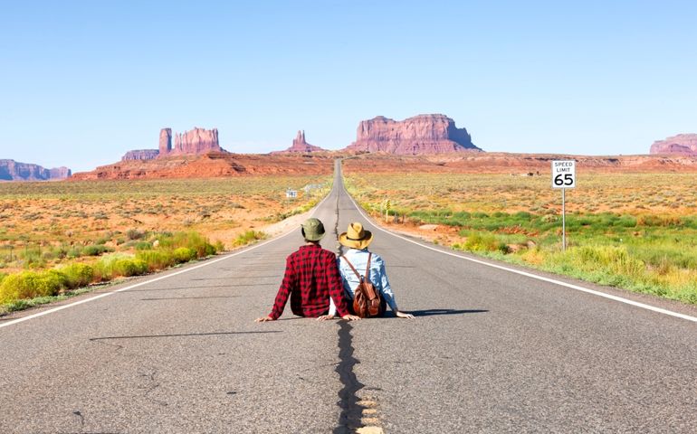 Happy couple on the famous road to Monument Valley