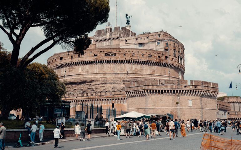 A crowd of people around the streets surrounding the Castel Sant'Angelo