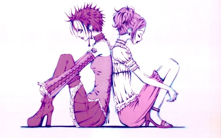 Two anime-style young women sit back-to-back against a white background. The woman on the left has spiky hair, platform boots, and punk clothing with lace accents. The woman on the right wears soft, feminine clothes and heels, with her hair tied in a bun.
