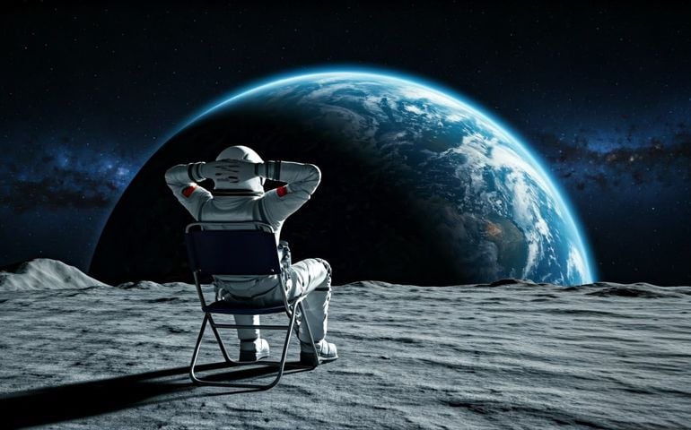 An astronaut in a white spacesuit sits in a folding chair on the Moon, hands resting behind their head, gazing at Earth glowing blue and white against the dark star-filled expanse of space.